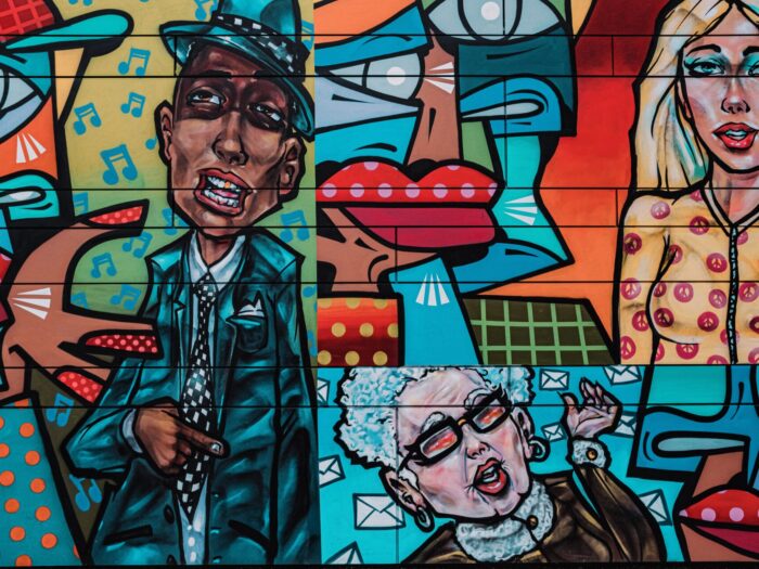 Colourful graffiti of people, photograph by Samuel Regan Asante