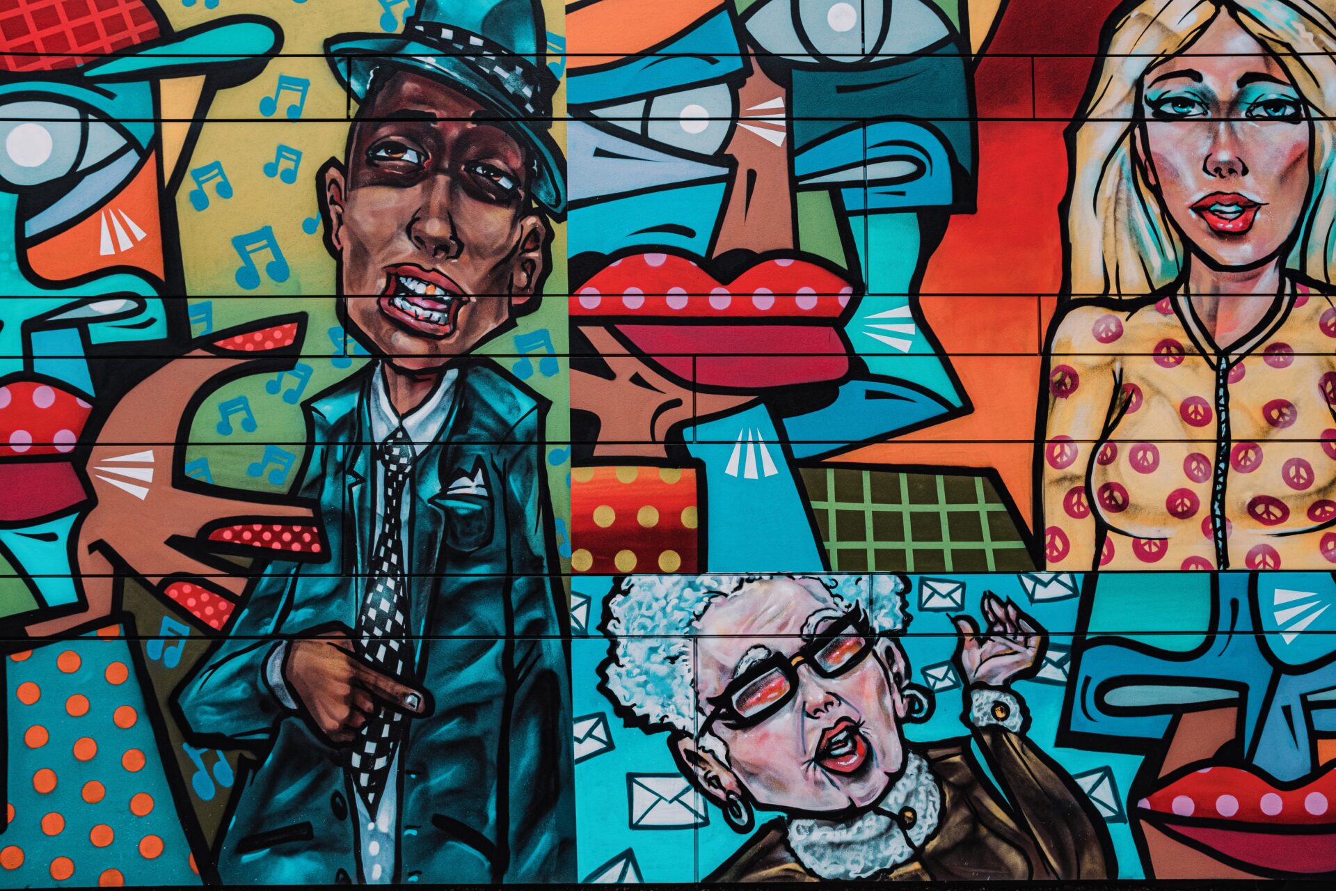 Colourful graffiti of people, photograph by Samuel Regan Asante